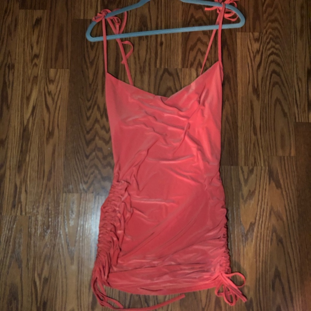 Orange cowl front mini dress.